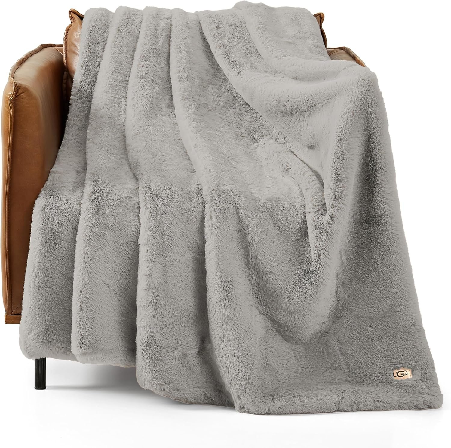 UGG Euphoria plush faux fur throw blanket showing luxurious reversible design in cream color