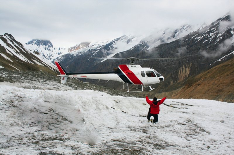 Global Rescue helicopter field rescue operation in snow